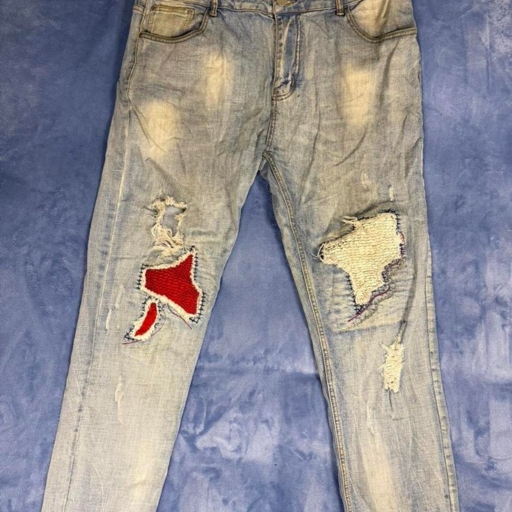 Distressed blue denim jeans with red patches, Size: 38